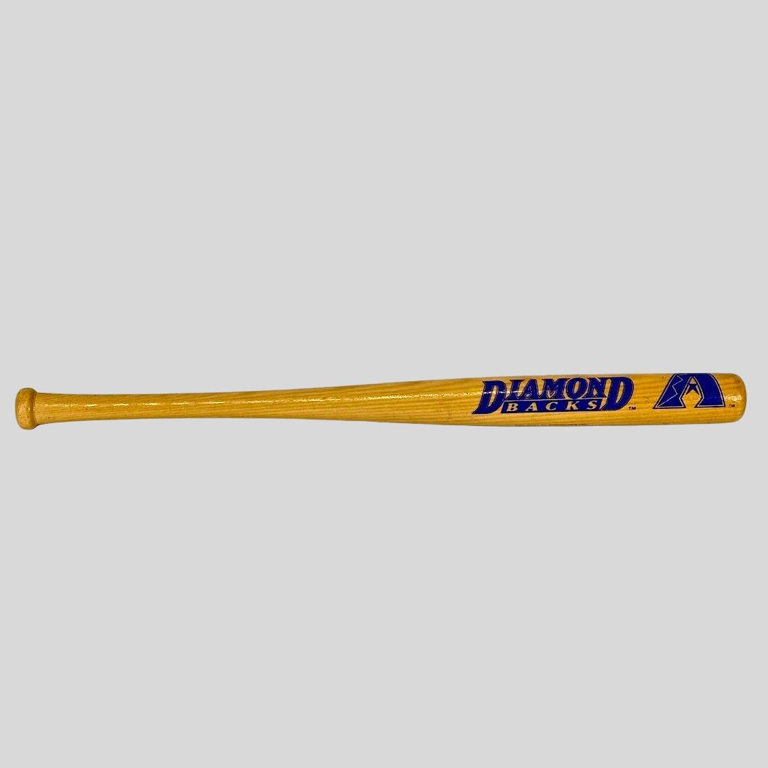 Wooden baseball bat with 'Diamondbacks' branding on a white background