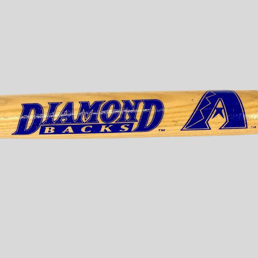Baseball bat with 'Diamondbacks' logo on a white background