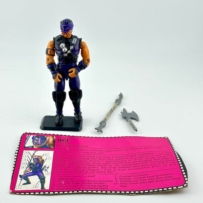 Toy figure with accessories and a pink card on a white background