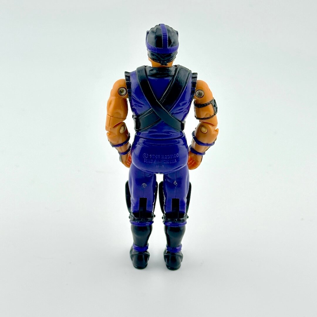 Action figure in purple and black outfit against white background.