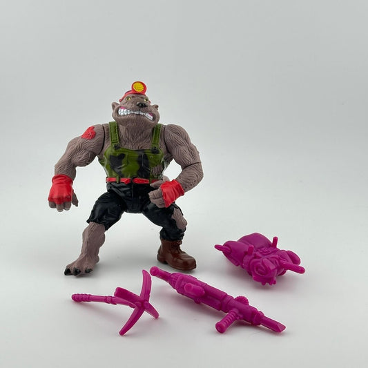 Anthropomorphized groundhog wearing camo mining uniform, red gloves, with purple accessories.