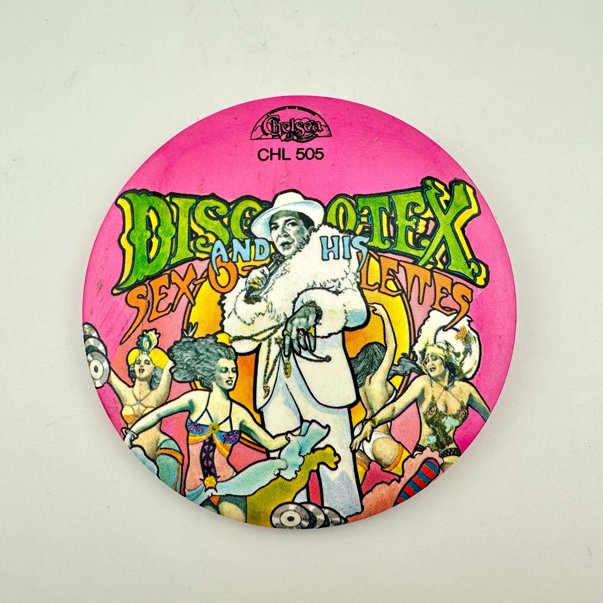 A circular pink pinback button badge featuring the album cover art for Disco-Tex and the Sex-O-Lette. 
