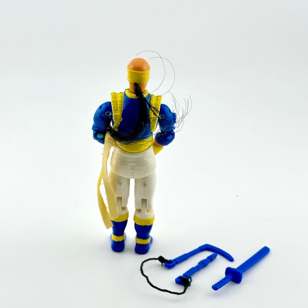 Toy figure with blue and yellow accents on a white background