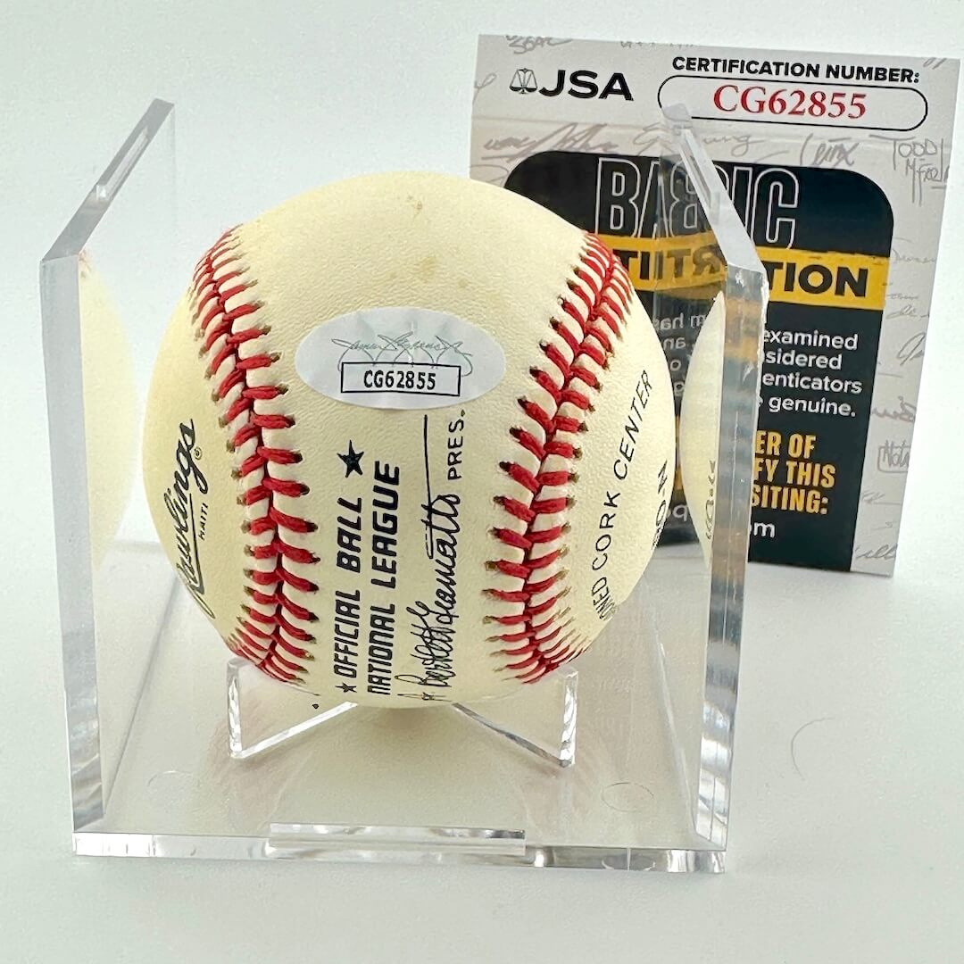 Baseball in a clear display case with a JSA certification card in the background