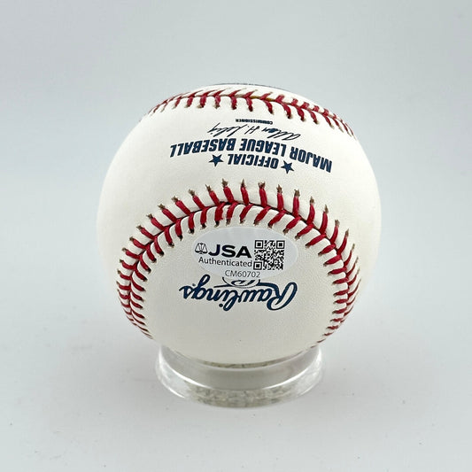 Baseball with JSA authentication on a gray background