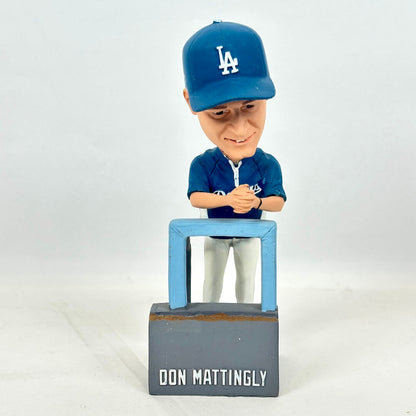 A bobblehead figurine of baseball player Don Mattingly in a blue Los Angeles Dodgers uniform and cap.