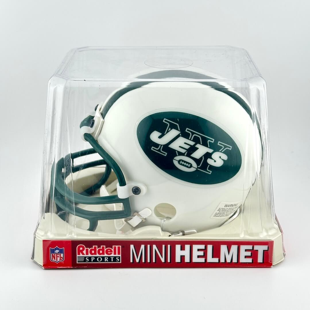 Mini football helmet with 'Jets' logo in clear packaging on a white background