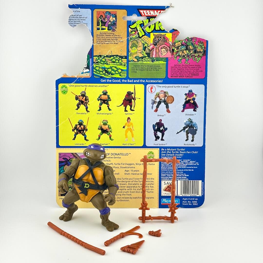 TMNT turtle with accessories and card back on white background. 
