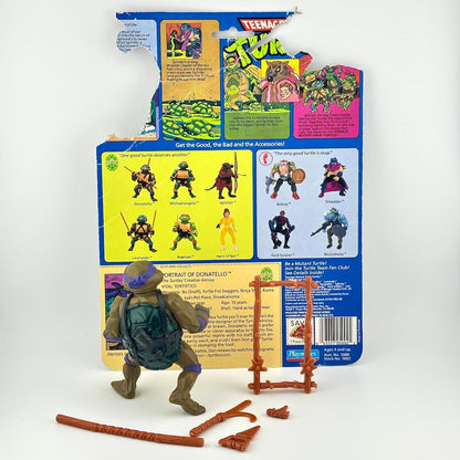 TMNT turtle with accessories and card back on white background. 