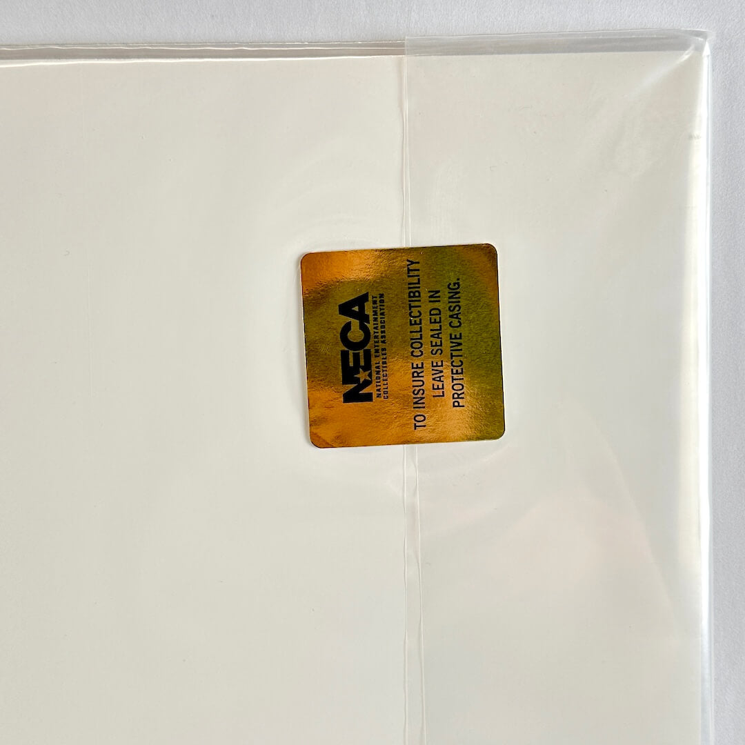 Gold label with 'NECA' text on a white background