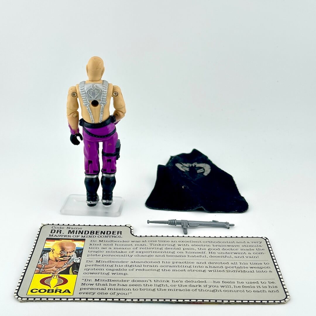 Toy figure of Dr. Mindbender with accessories and character card on a white background