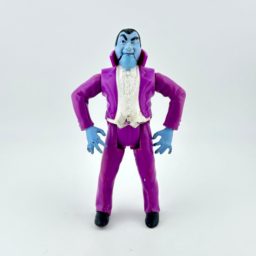 Action figure in a purple suit with blue skin on a white background