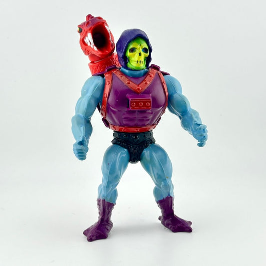 Skeletor action figure with purple armor and red dragon riding his back. 