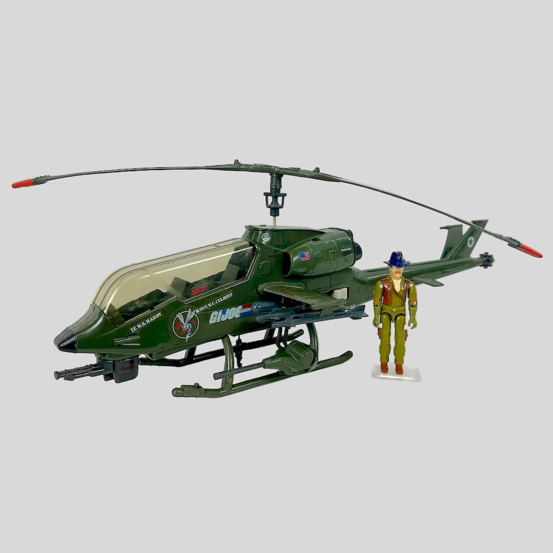 Toy helicopter with a figure on a white background