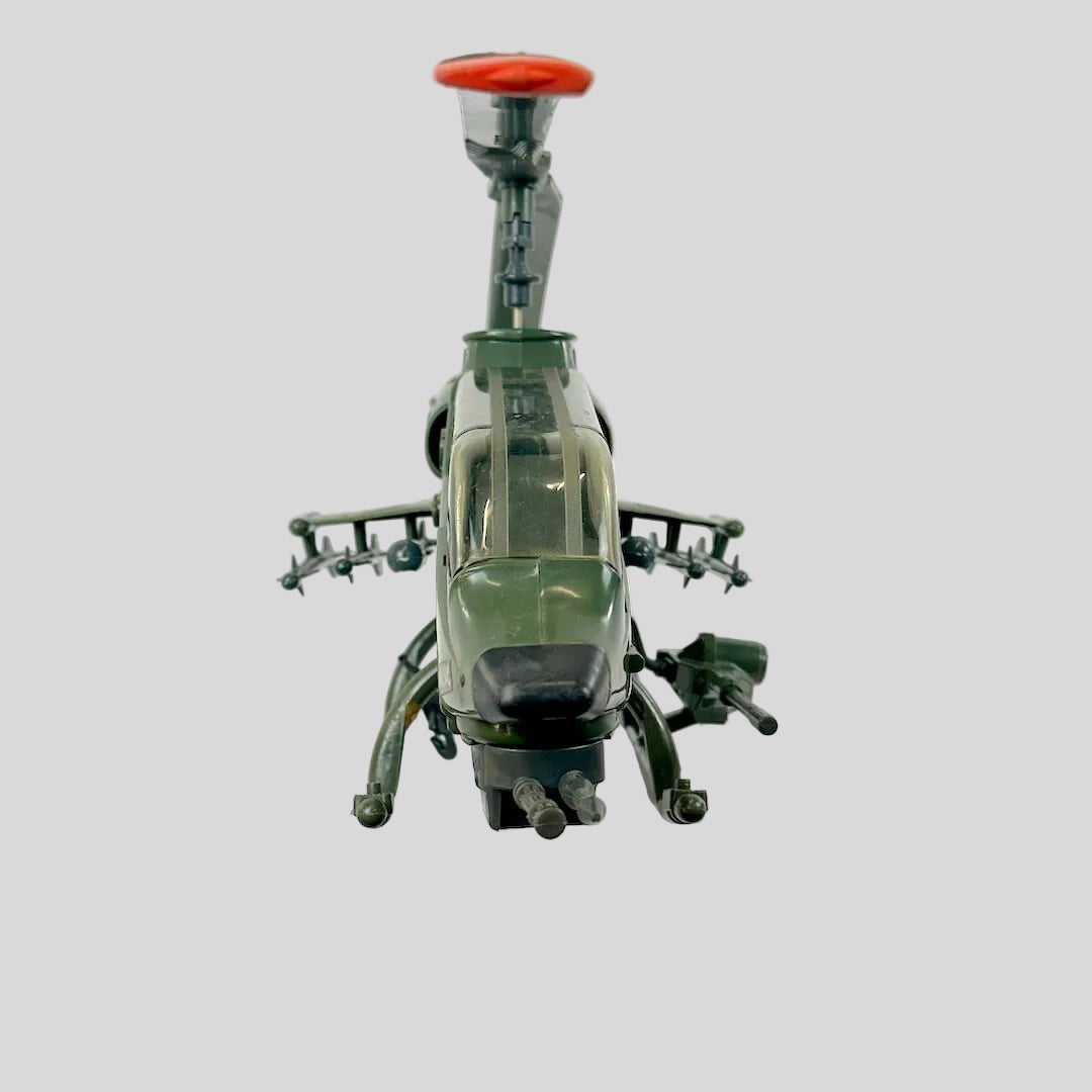 Toy helicopter with a red rotor on a white background