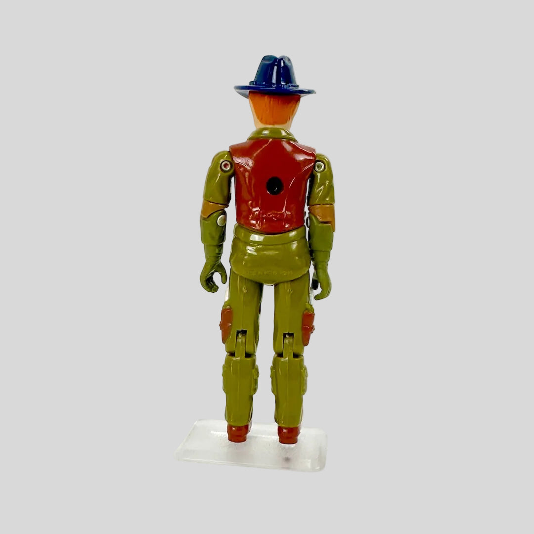 Toy figure with a blue hat and brown shirt on a white background