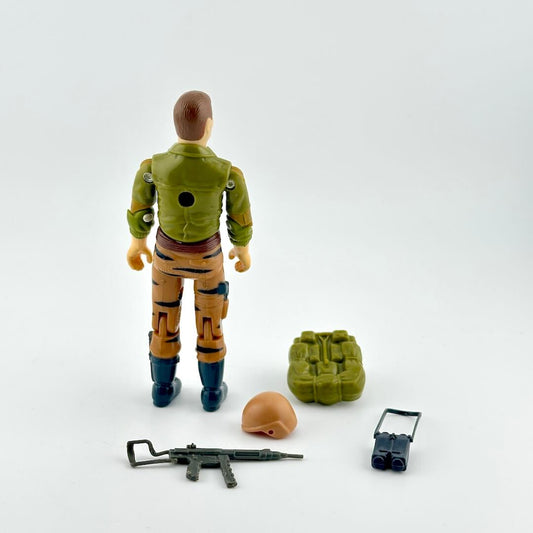 Back of GI Joe action figure with accessories against white background. 