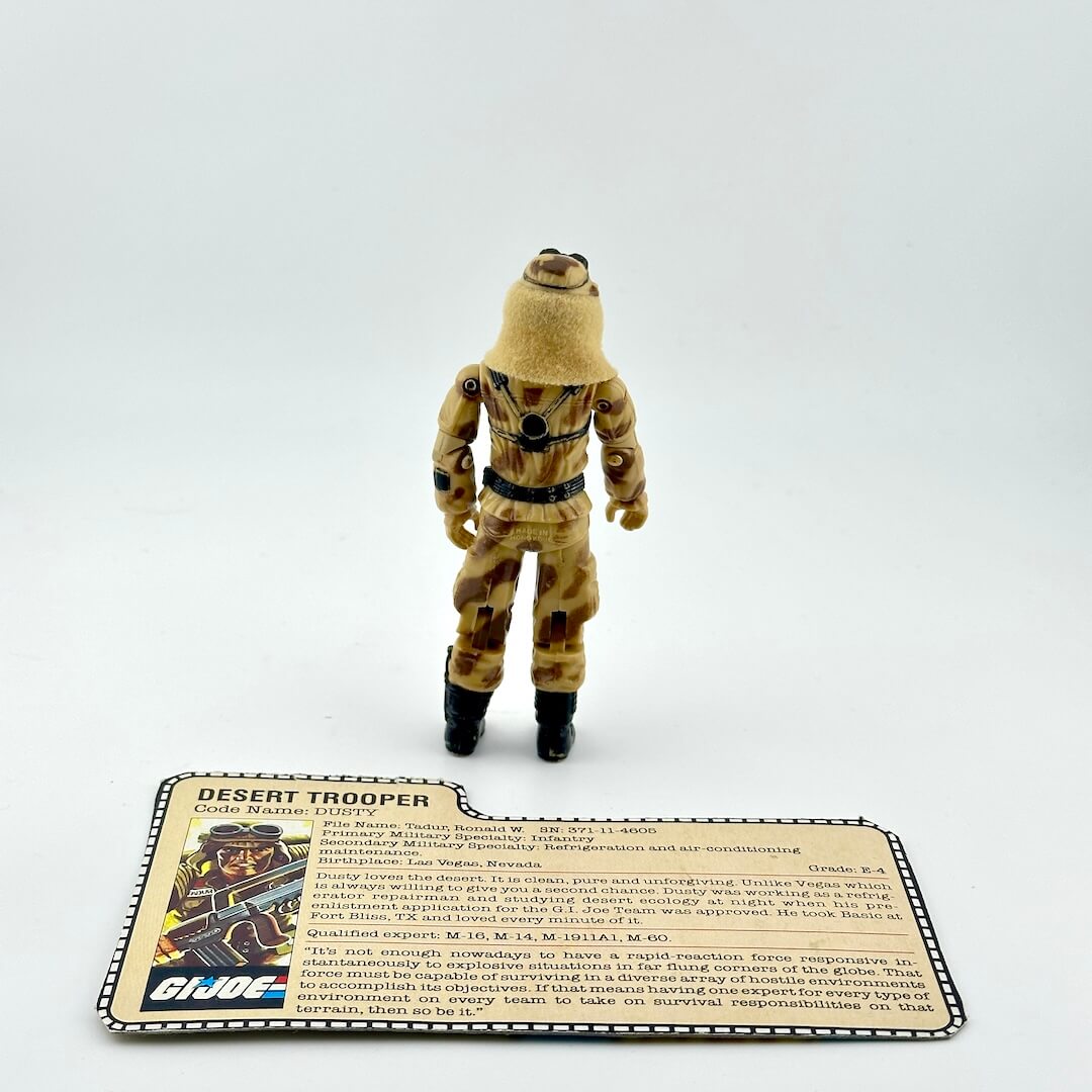 Desert Trooper figure with a card on a white background
