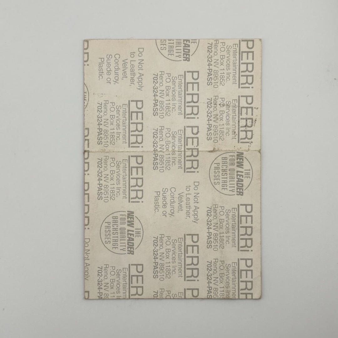 Backside of pass with paper backing still attached, in excellent condition. 