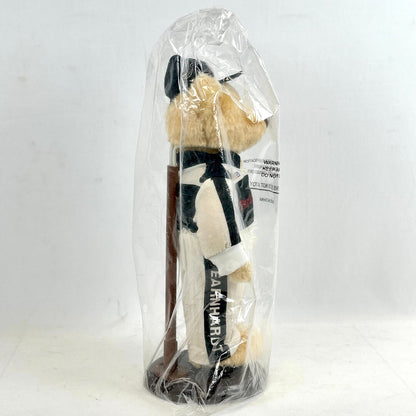Plush toy in a clear plastic bag on a white background