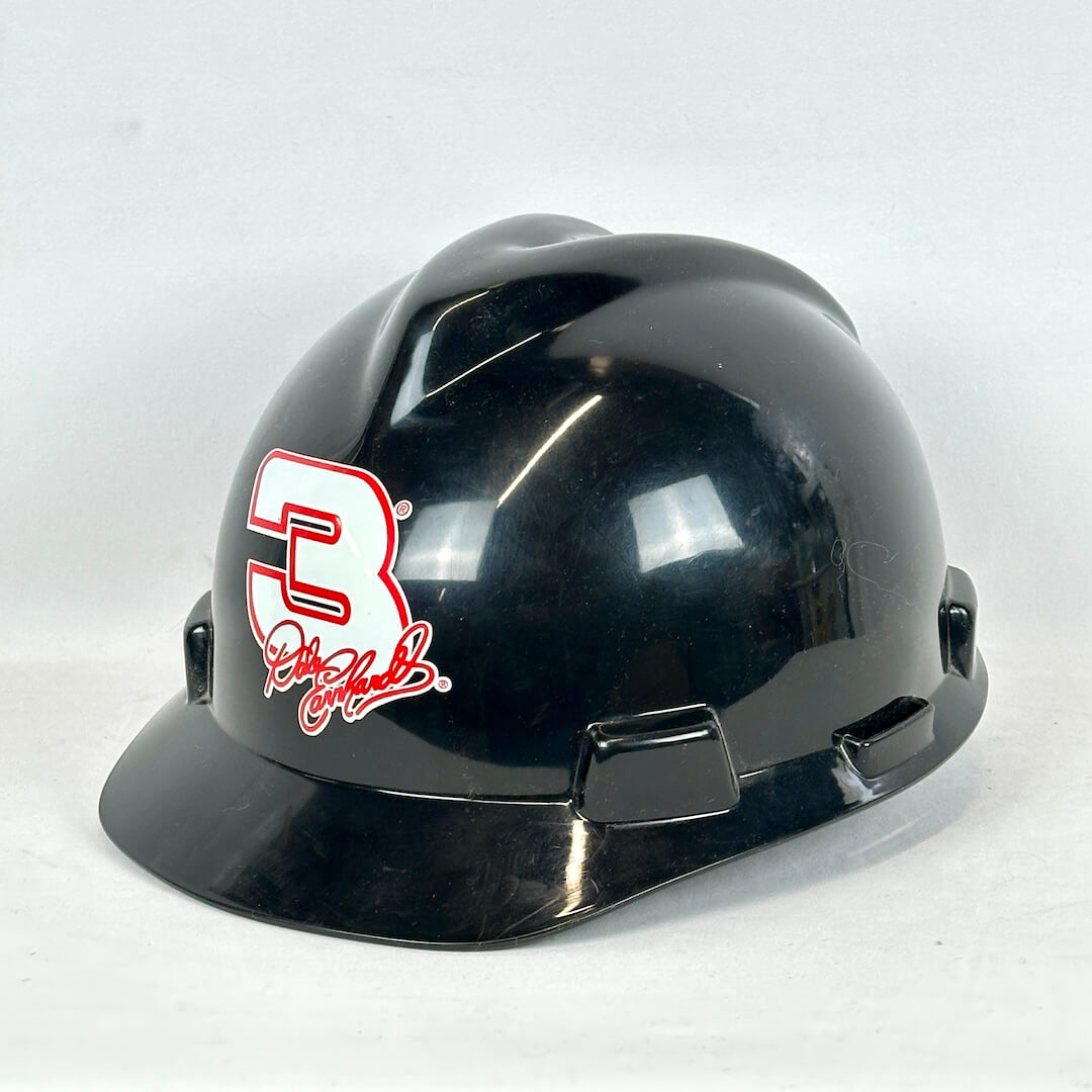 Black hard hat with a red logo on a white background
