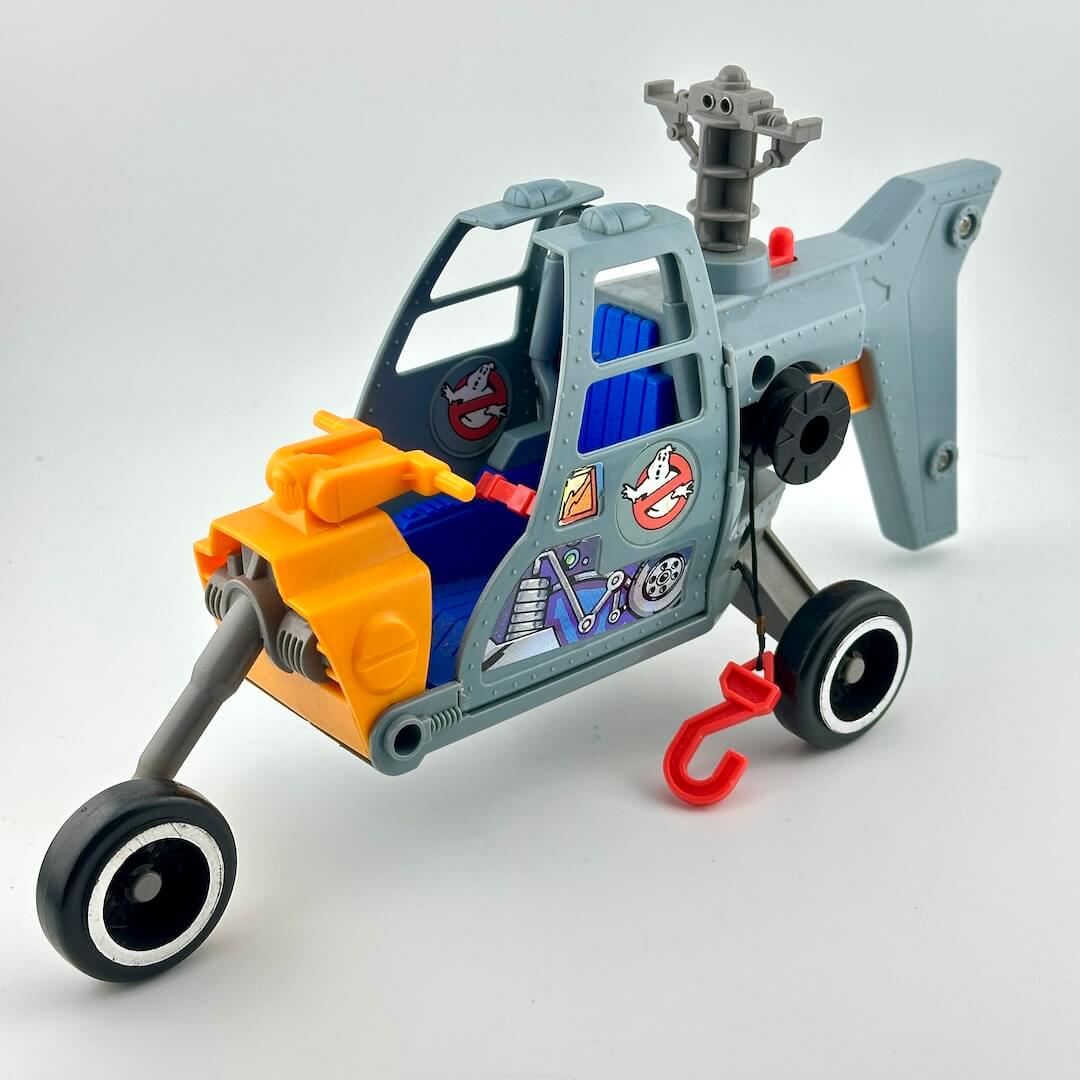 Toy vehicle with a helicopter and car design on a white background