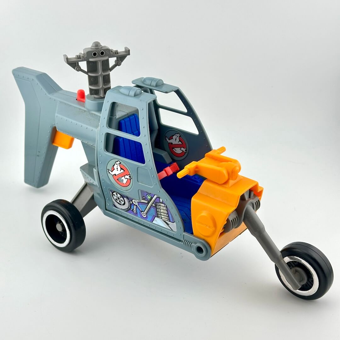 Toy vehicle with a helicopter and car design on a white background