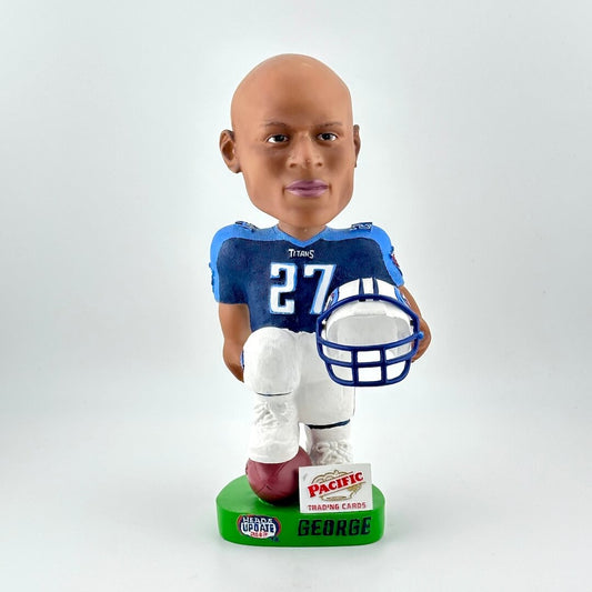 Bobblehead of football player holding helmet against white background. 