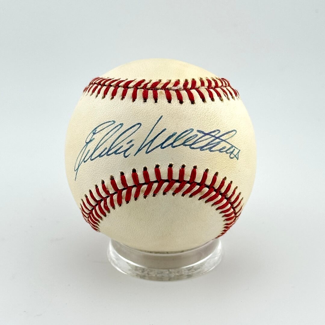 Baseball with autograph on a white background