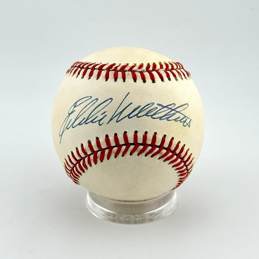 Baseball with autograph on a white background