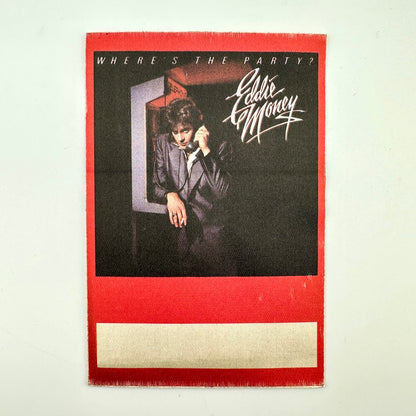 Red backstage pass with photo of Eddie Money at a payphone next to stylized text, "Eddie Money"
