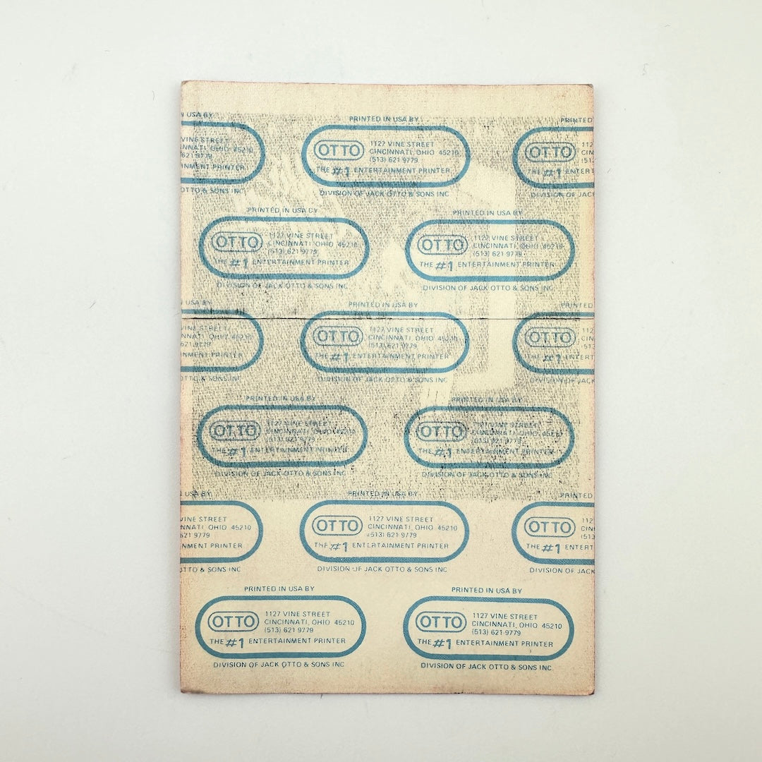 Backside of pass showing intact paper backing and mint condition. 