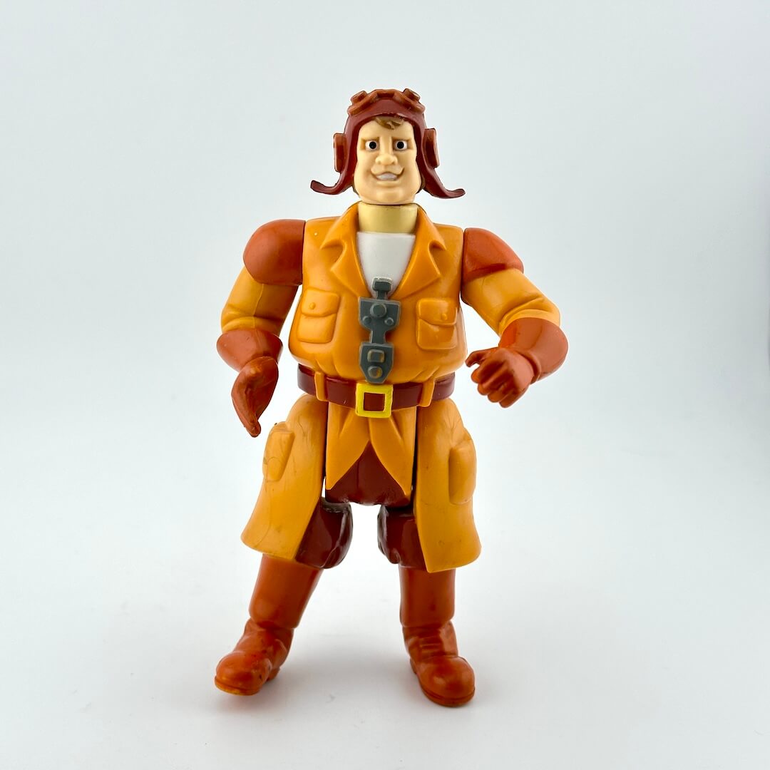 Action figure in orange and brown outfit on a white background