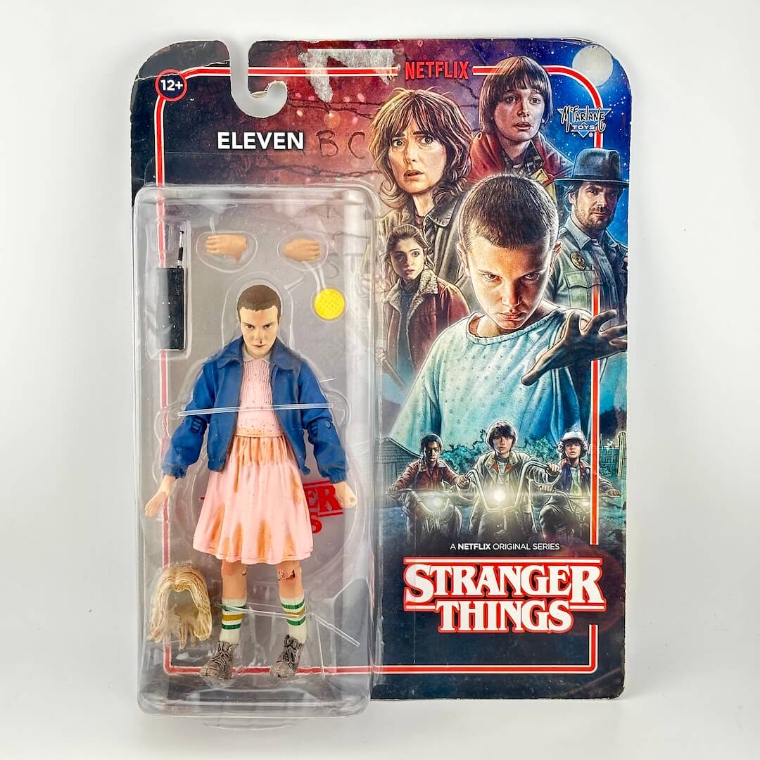 Stranger Things Eleven action figure in its original blister card packaging.