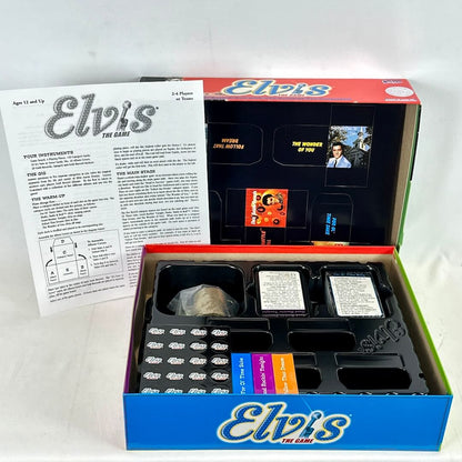 Elvis-themed board game box with game pieces and instructions on a white background