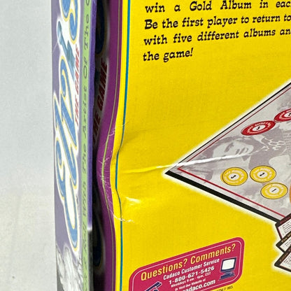 Close-up of a card game box with text and a card featuring a face.