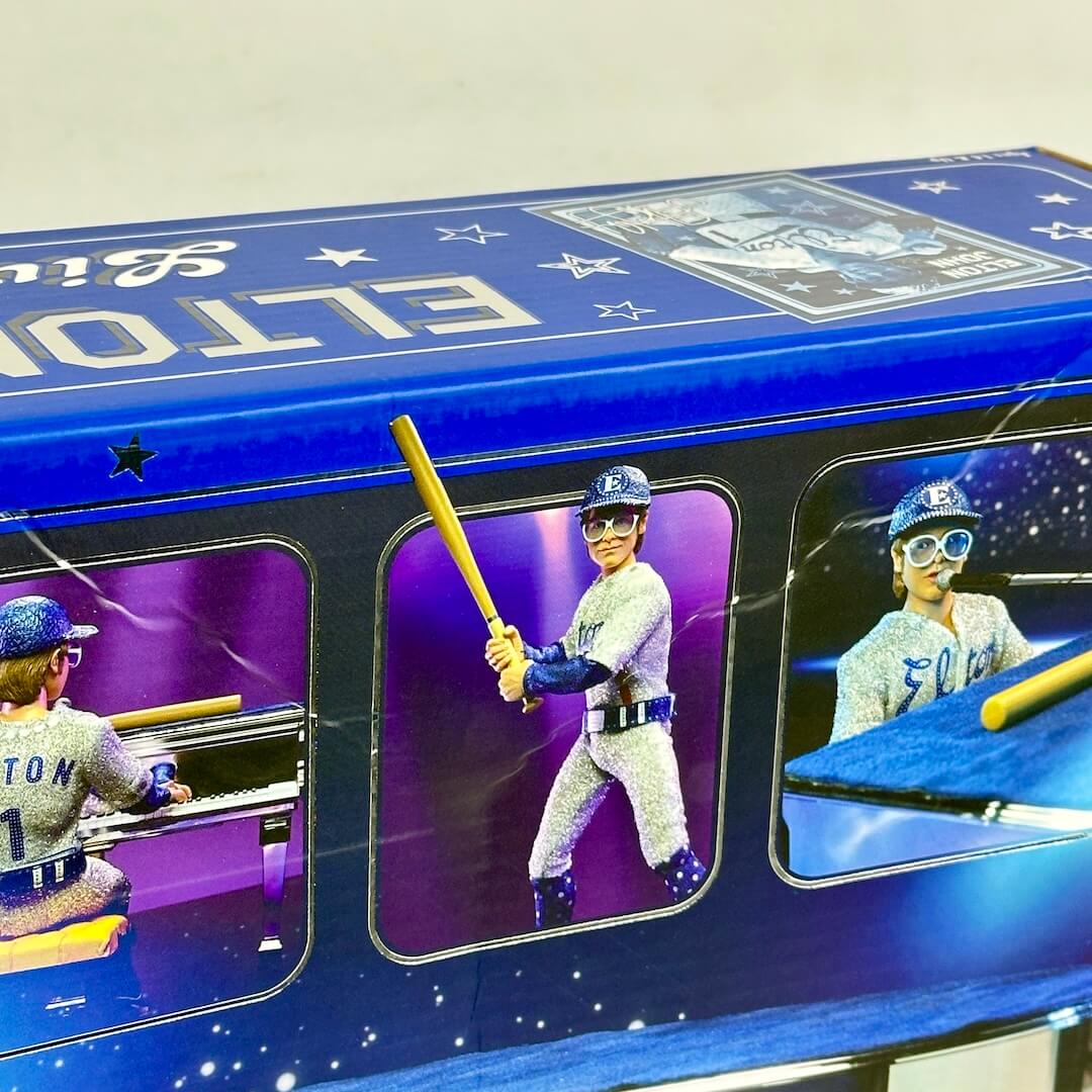 Blue toy box with a baseball player figure and bat on a white background
