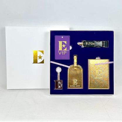 Elton John branded luggage tags and notebook set in a box on a white background