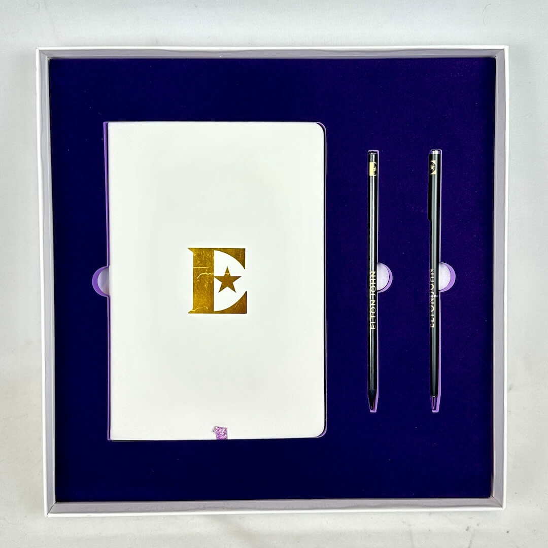 Notebook with a pen set on a blue background