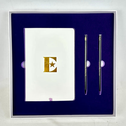 Notebook with a pen set on a blue background