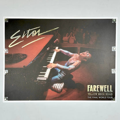 Promotional poster for Elton John's 'Farewell Yellow Brick Road' tour with a performer on stage.