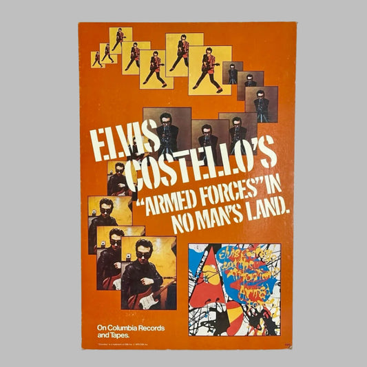 Orange display with several images of Elvis playing guitar, album name stenciled across cent, album art at bottom corner. 