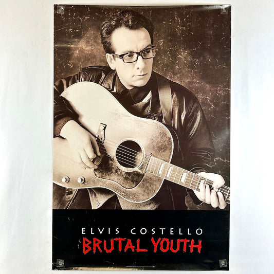 Poster of Elvis Costello holding a guitar with 'Brutal Youth' text