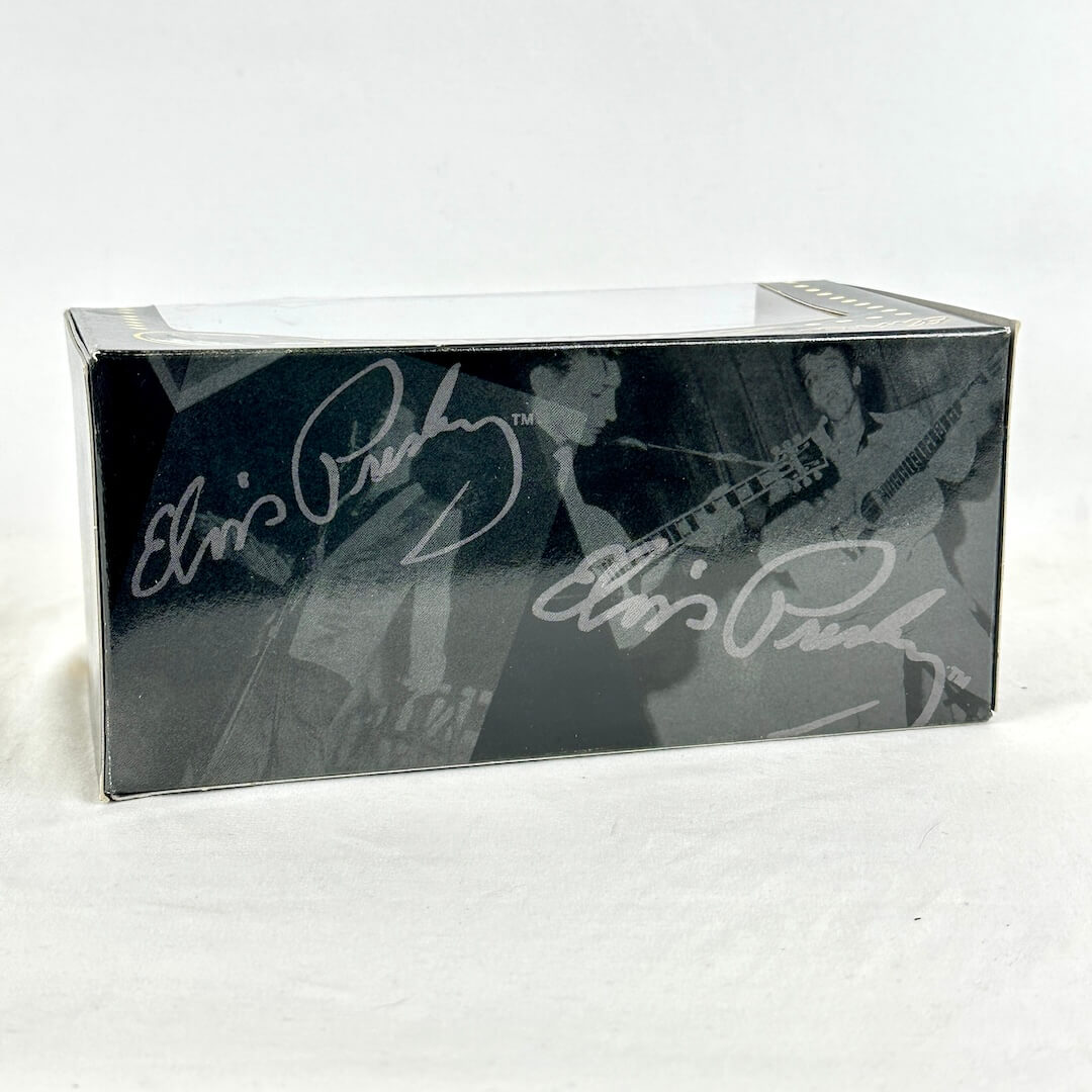 Backside of Matchbox car set with Elvis Presley branding and facsimile signatures. 