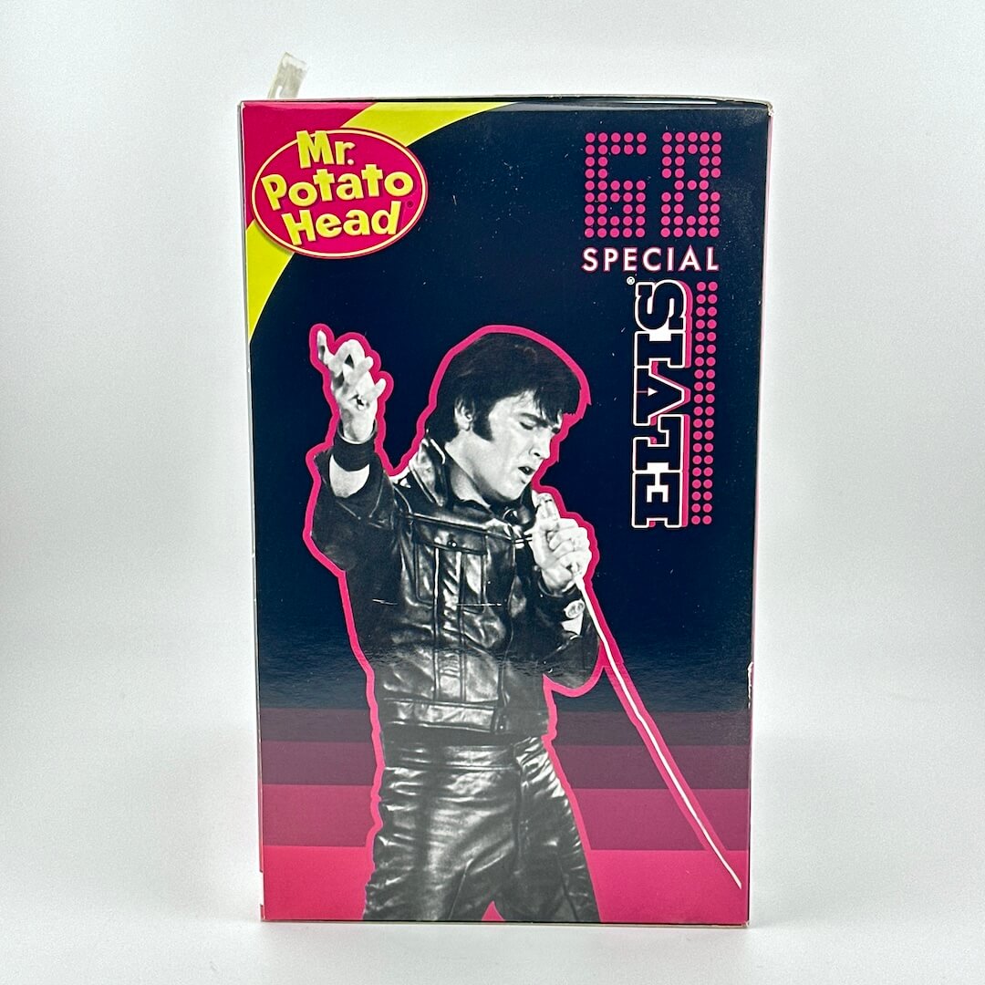 Box for a Mr. Potato Head Elvis toy with a black and white image of Elvis Presley on a pink background.