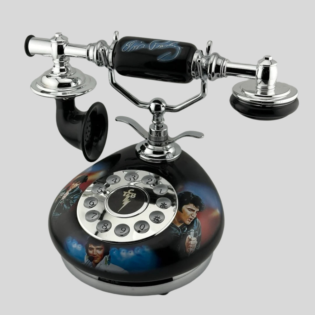 Rotary phone with images of Elvis on base, & Elvis Presley in blue across handle. Silver & black object.