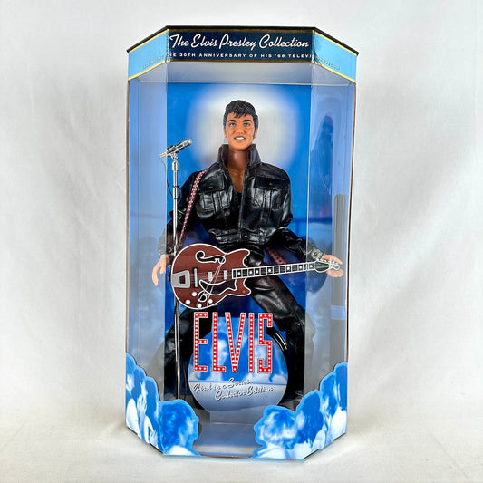 Elvis Presley doll in packaging holding guitar