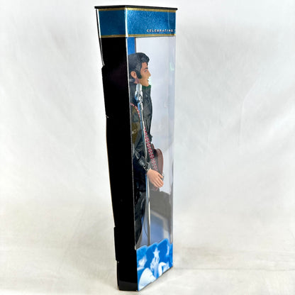Toy figure in a box with a guitar, on a white background