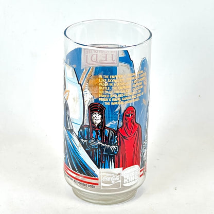 Drinking glass with Star Wars-themed design featuring characters and text on a white background