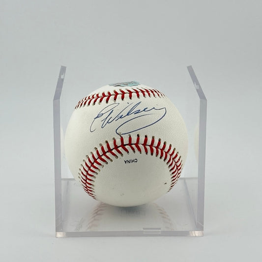 Autographed baseball in plastic cube. Half of cube removed to show clear signature.
